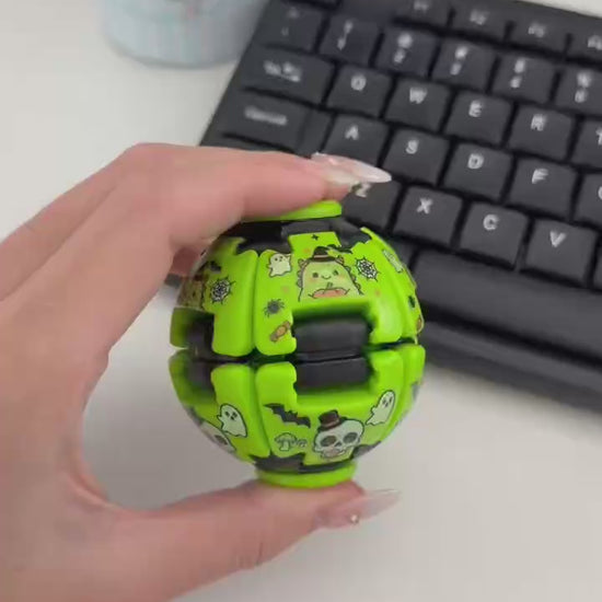 Green Halloween fidget spinner ball demonstration showing handheld play

